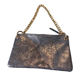 Big Buddha metallic faux animal skin small purse with gold chain.